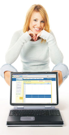 A woman in front of a laptop running the BaseDiary application